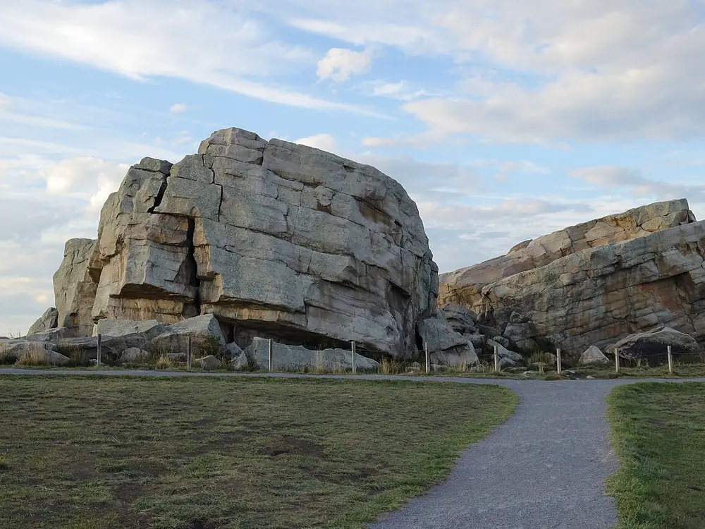 The Okotoks Erratic, a huge split glacial boulder, with a gravel path leading up to it